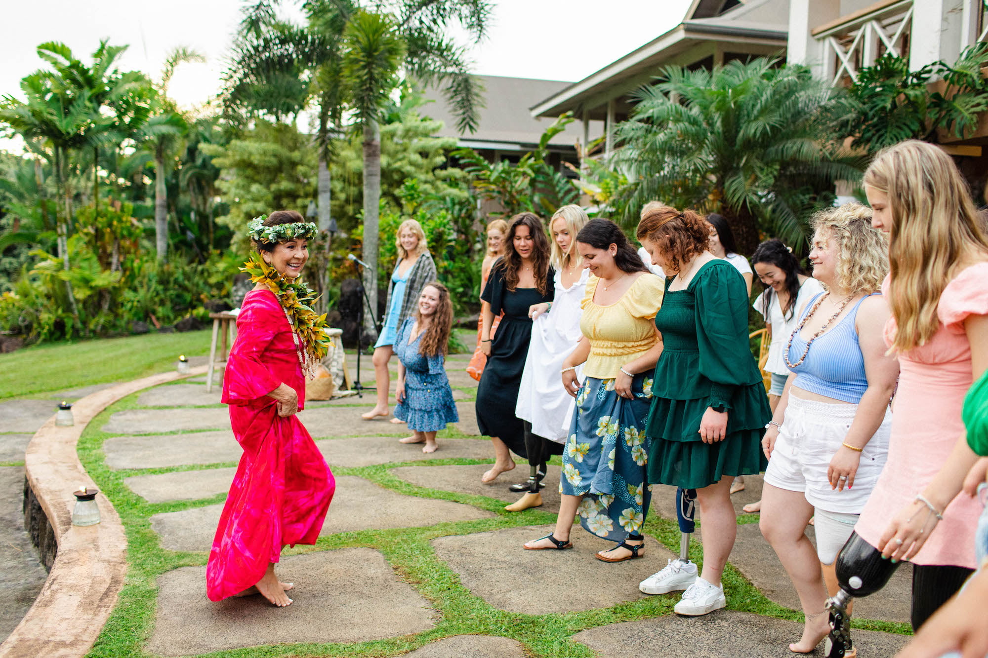 Kumu Lei teaching our retreat attendees how to dance hula