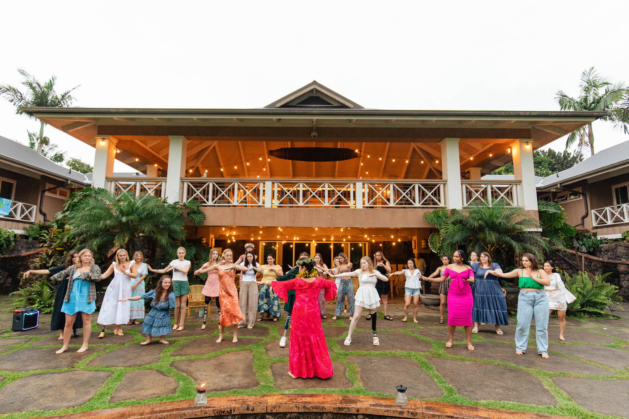 Wide shot of Kumu Lei teaching our retreat attendees how to dance hula