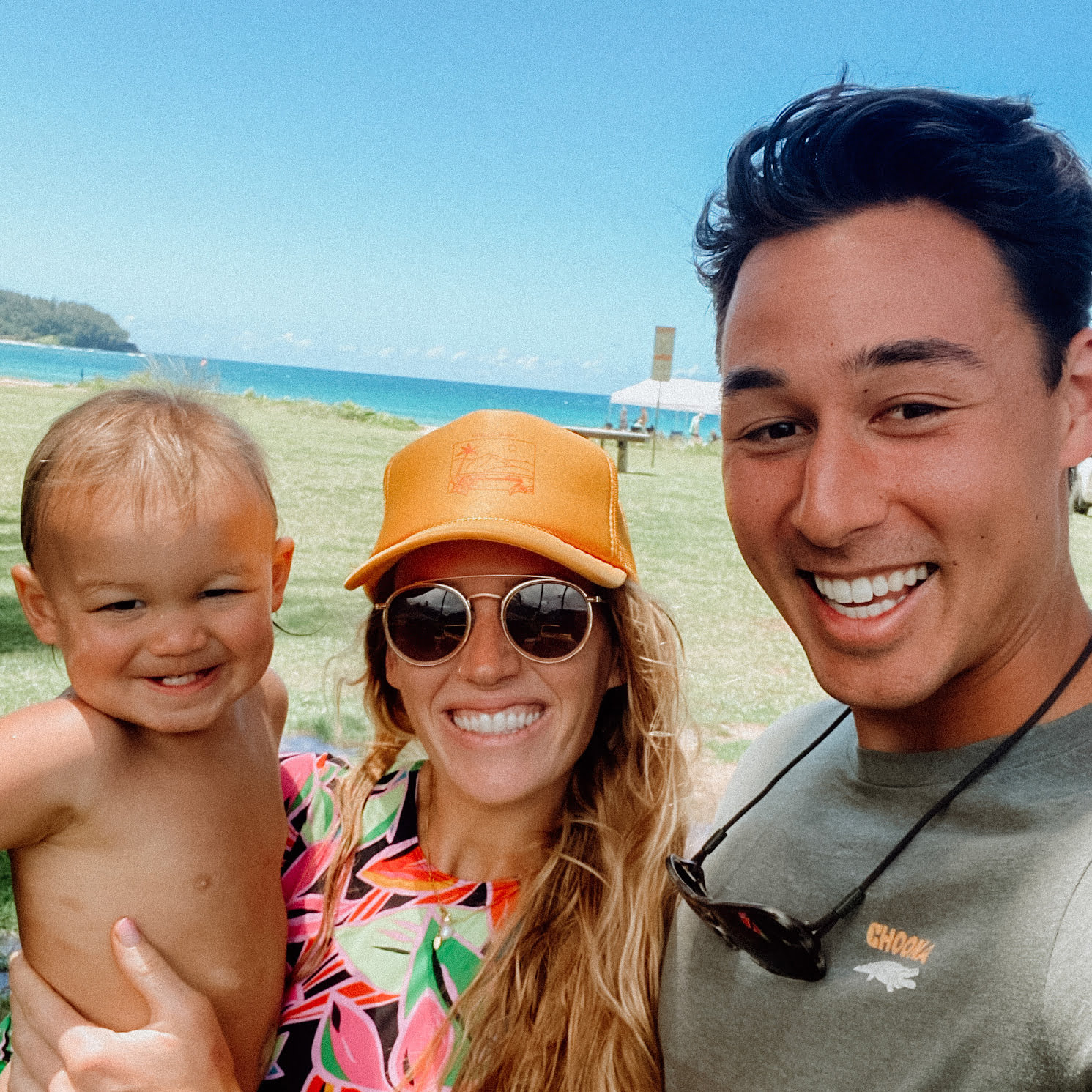 Kate, her husband, and son on their trip to Kauai